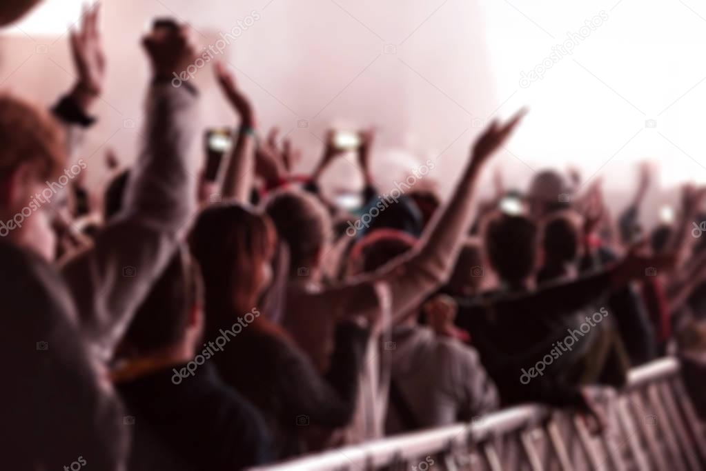 Blurred crowd of people at music festival