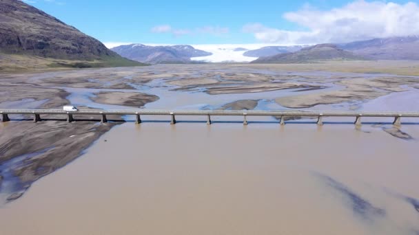 Aerial Drone View Car Crossing Bridge River Transporting Glacial Deposits — Stock Video