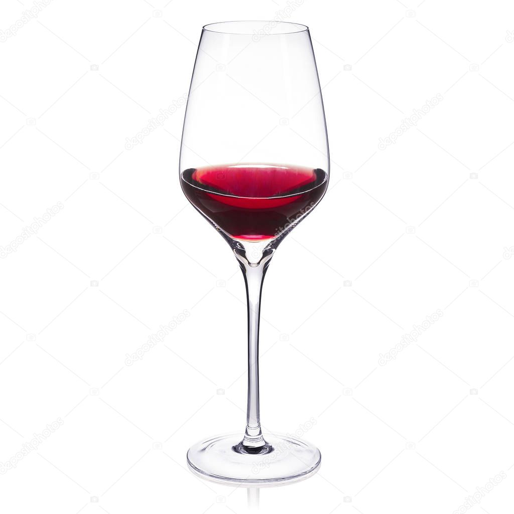 Crystal wine glass on white background with red wine in it