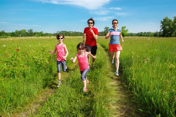 Family fitness outdoors, parents with kids jogging in park, running and healthy lifestyle