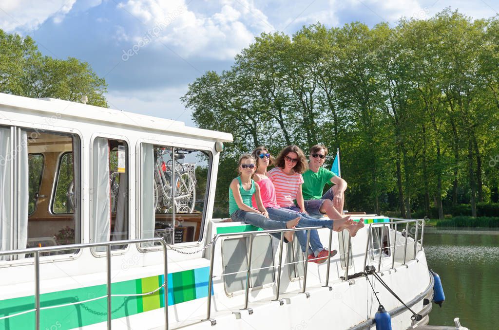 Family vacation, travel on barge boat in canal, happy kids having fun on river cruise trip in houseboat
