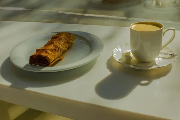 A cup of coffee and pastries. — Stock Photo, Image