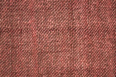 Pembe ve açık kahverengi renkler, desensiz tek renkli bir yüzey. El yapımı, el yapımı. Kaba doğal kumaş..