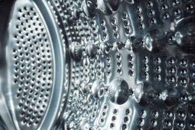 Gri, parlak çelik yüzey, metal. Soyut desen, bölümün içi. Kenarları bulanık..