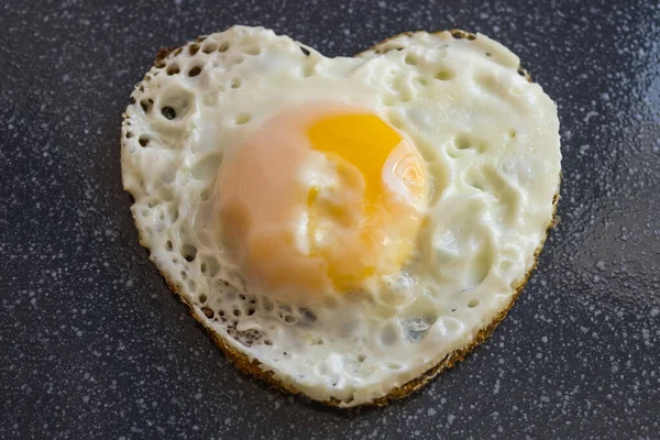 Fried egg, breakfast, cooked by own hands. Cooking with the soul, simple food. An explanation in love. Good morning.