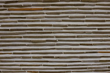 Duvar dekoru elementi, kahverengi yatay kırık çizgiler. Hafif arkaplan, sıva.