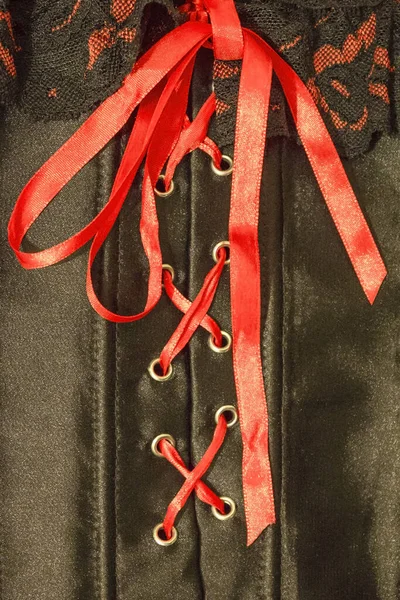 Black Silk Corset Tied Red Satin Ribbon Sexual Appeal Provocation — Stock Photo, Image