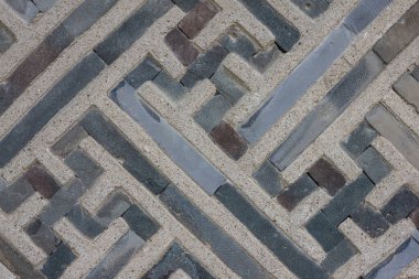 Süslü eski duvarın dokusu. Eski sembol, gamalı haç, doğurganlık işareti..