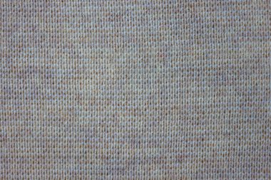 Doğal malzemeden yapılmış yoğun örülmüş kumaş. Kalıpsız açık gri renk.