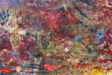 Ahşap politra üzerinde bir sürü farklı renkte yağlı boya karışımı var. Parlak, çok renkli doku, geniş fırça darbeleri. Üst manzara, gün ışığı..