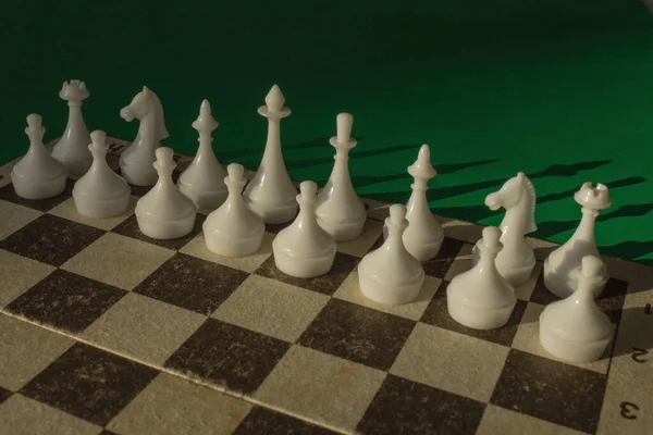 The chess game, the figures, White's pawns are lined up in two rows. Waiting for the first step, move, the opponent's actions. Confrontation, calculation of a possible combination.