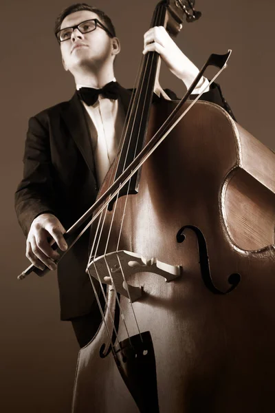Double bass player playing contrabass — Stock Photo, Image