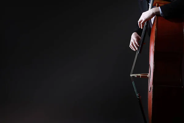 Double bass player. Hands playing contrabass — Stock Photo, Image