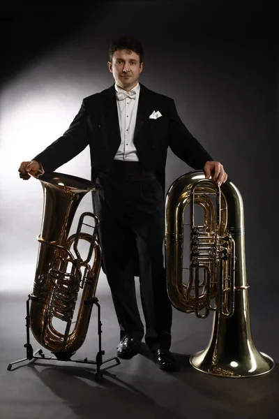 Tuba brass instrument. Classical musician portrait man horn play