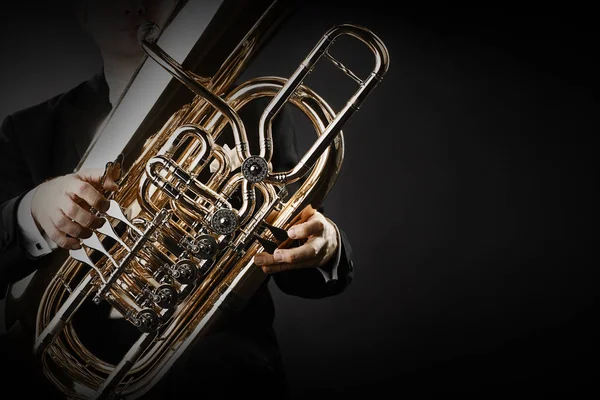 Tuba brass instrument hands closeup
