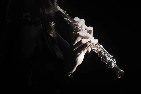 Flutist hands playing flute music — стоковое фото