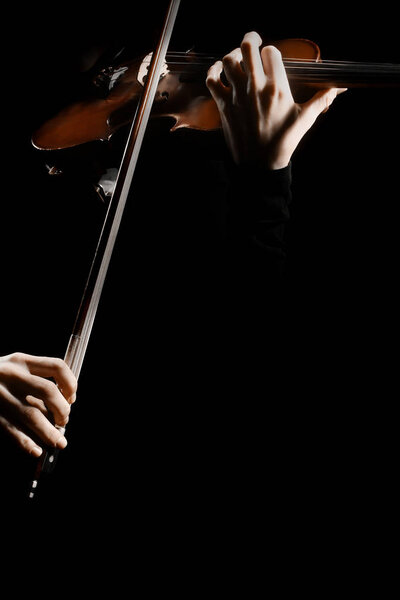 Violin player. Violinist playing violin hands closeup