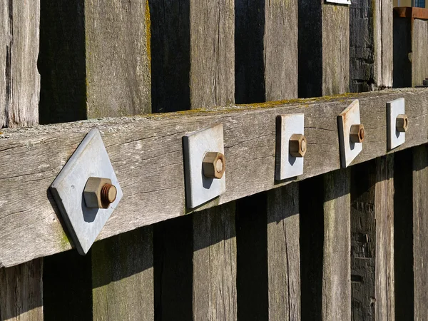 Wooden dock breakwall in a marina harbour — Stock Photo, Image