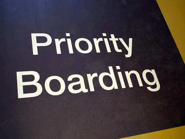 Priority boarding mat sign in an international airport — Stock Photo, Image