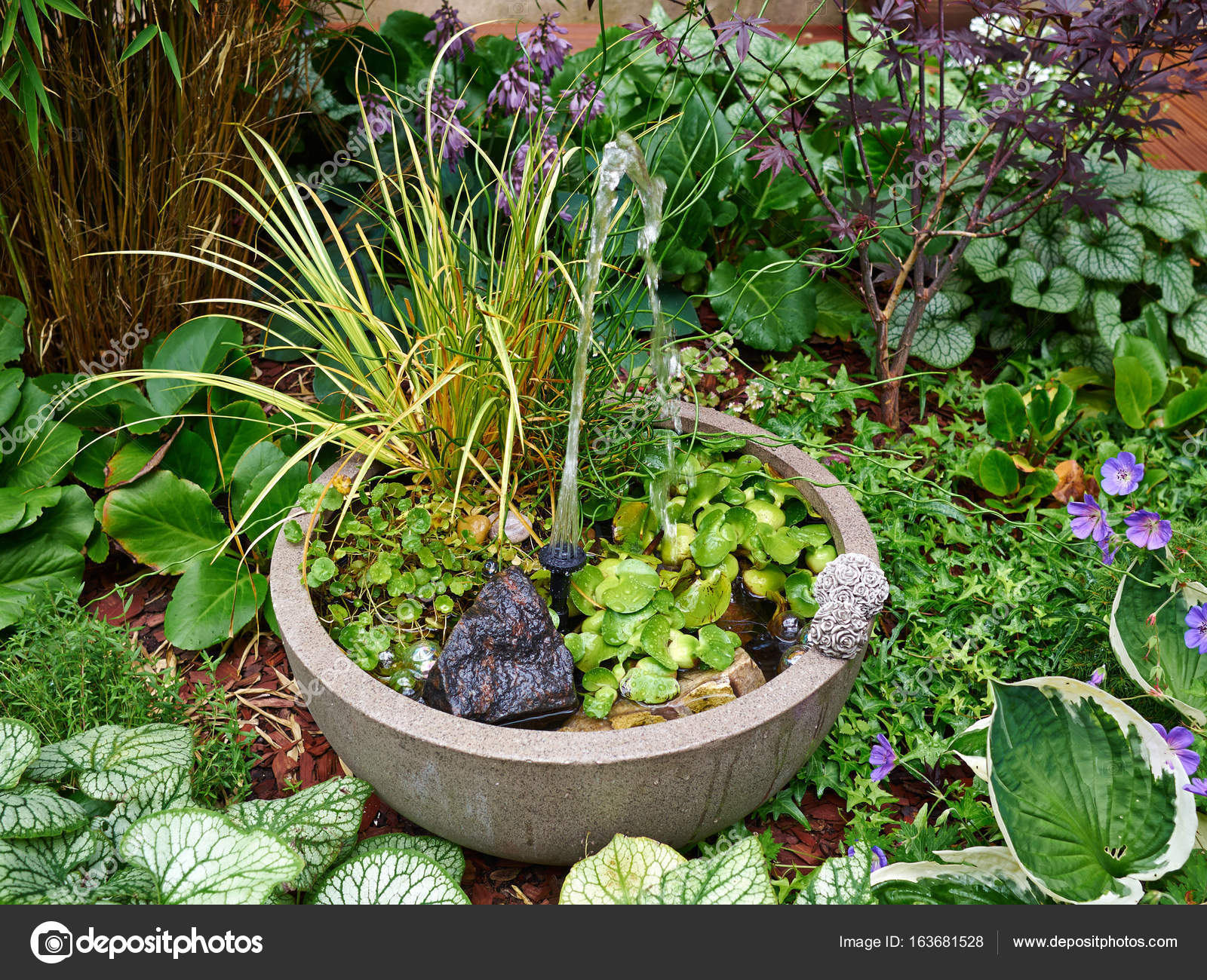 Small Water Fountain In A Beautiful Garden Stock Photo Image By C Ronyzmbow 163681528
