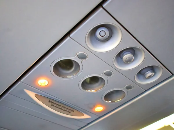 Passenger plane cabin overhead panel — Stock Photo, Image