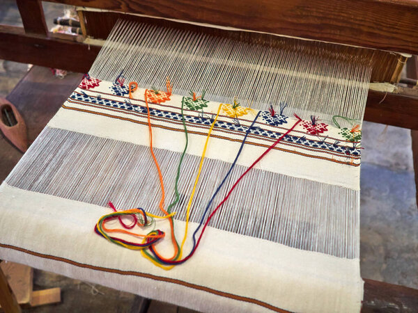 Traditional typical Cypriot folk hand craft weaving in beautiful colors and designs on a loom Cyprus