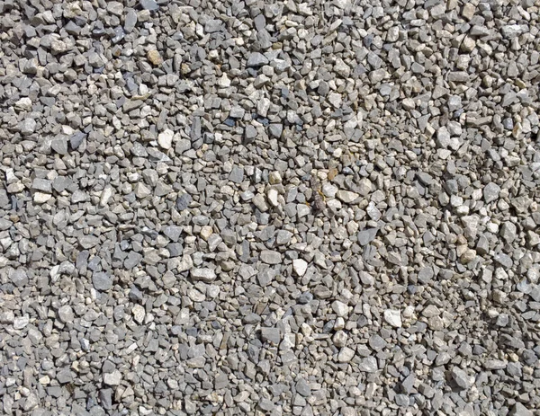 Struttura di pietra schiacciata. Piccolo sfondo di pietre. macadam — Foto Stock