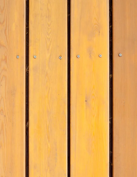 Żółto-brązowy deski drewniane, ogrodzenia — Zdjęcie stockowe