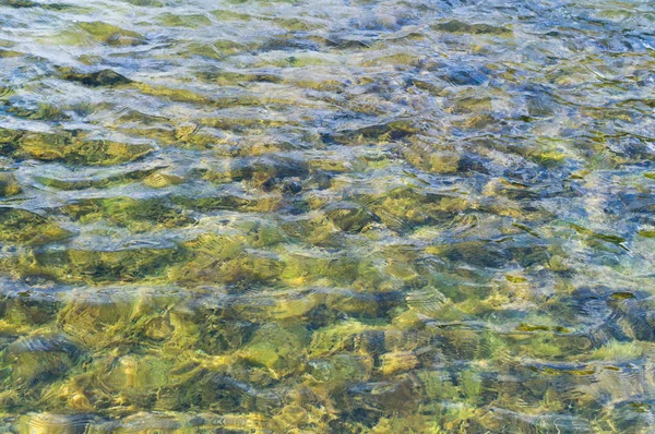 Textura da água na piscina de azulejos. fundo, natureza . — Fotografia de Stock