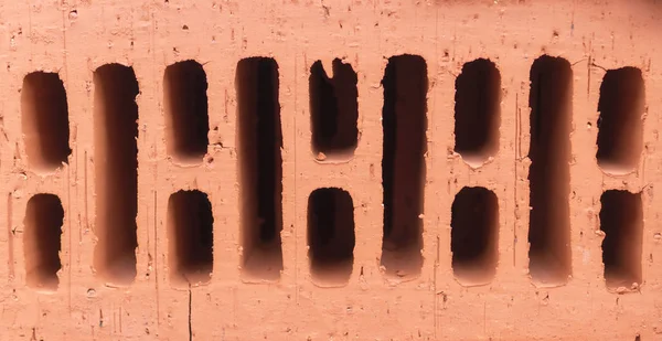 Turuncu kil tuğla yığını. doku, arka plan.