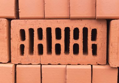 Turuncu kil tuğla yığını. doku, arka plan.