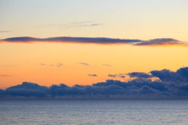 Bright cumulus clouds against the blue sky. Sunset sky Natural background. seascape