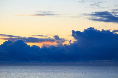Bright cumulus clouds against the blue sky. Sunset sky Natural background. seascape