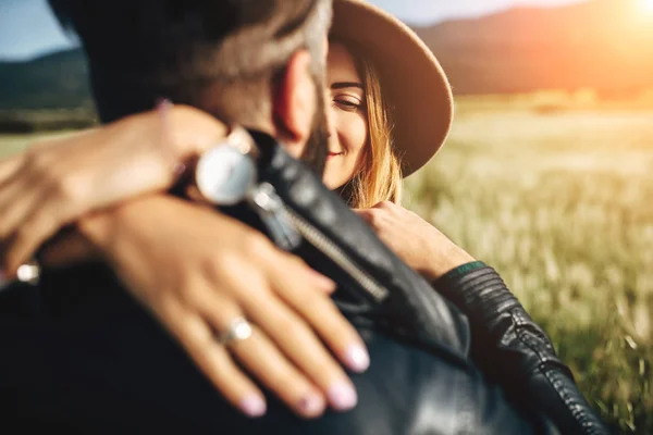 Young couple in leather jackets in the field — 스톡 사진