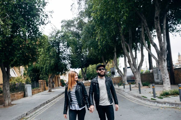 Happy couple in love walking in the town