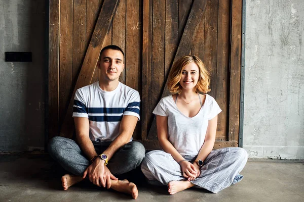 Young happy couple near the loft door — 스톡 사진