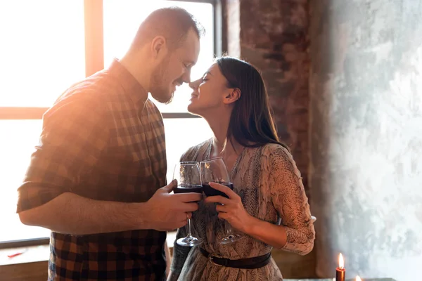 A couple in love in sunset light from window — 스톡 사진