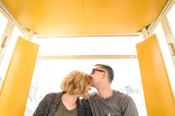 Loving couple in a booth on a ferris wheel — 스톡 사진
