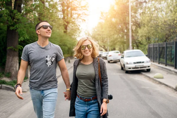 Couple walk around the city in spring
