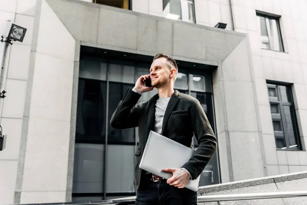 Modern young and creative businessman with laptop — Stock Photo, Image