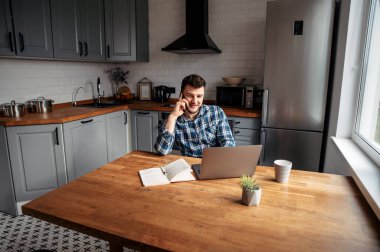 Young male freelancer works from home