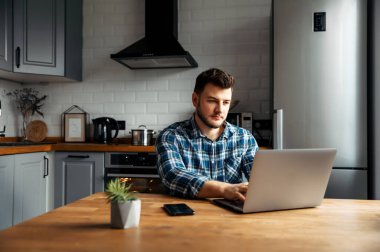 Young male freelancer works from home