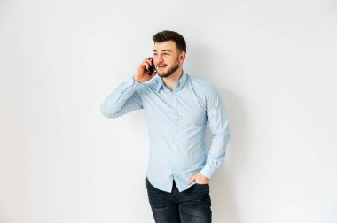 Isolated image of a man in a shirt with phone