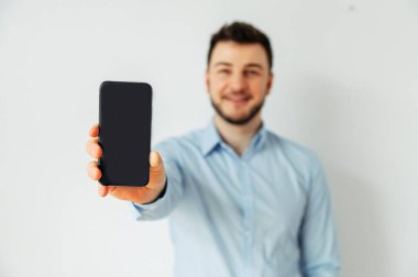 Isolated image of a man in a shirt with phone
