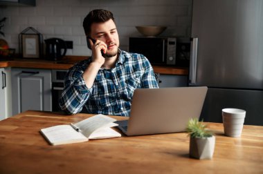 Young male freelancer works from home