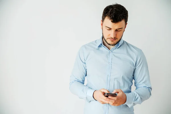 Isolated image of a man in a shirt with phone — Φωτογραφία Αρχείου