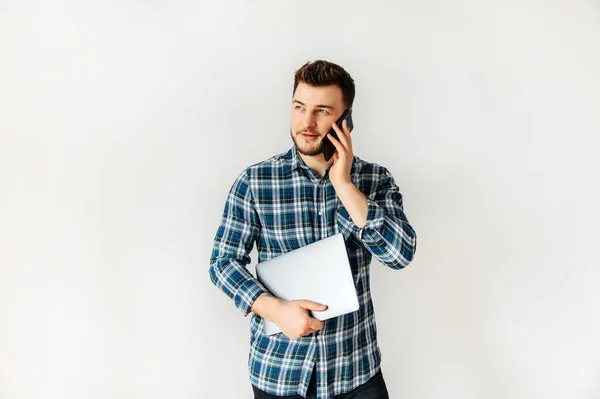 Handsome young male hipster with a laptop — Stockfoto