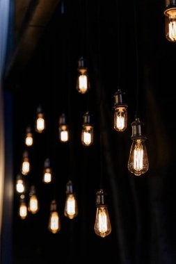 Evening wedding ceremony with garlands of lamps