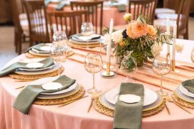 Elegant decor of a wedding bank in peach and green
