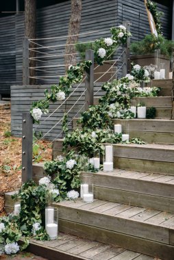 Steps decorated with garlands of green branches
